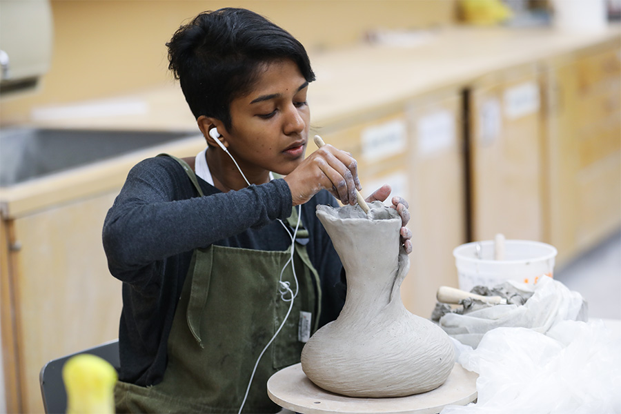 Student making pottery