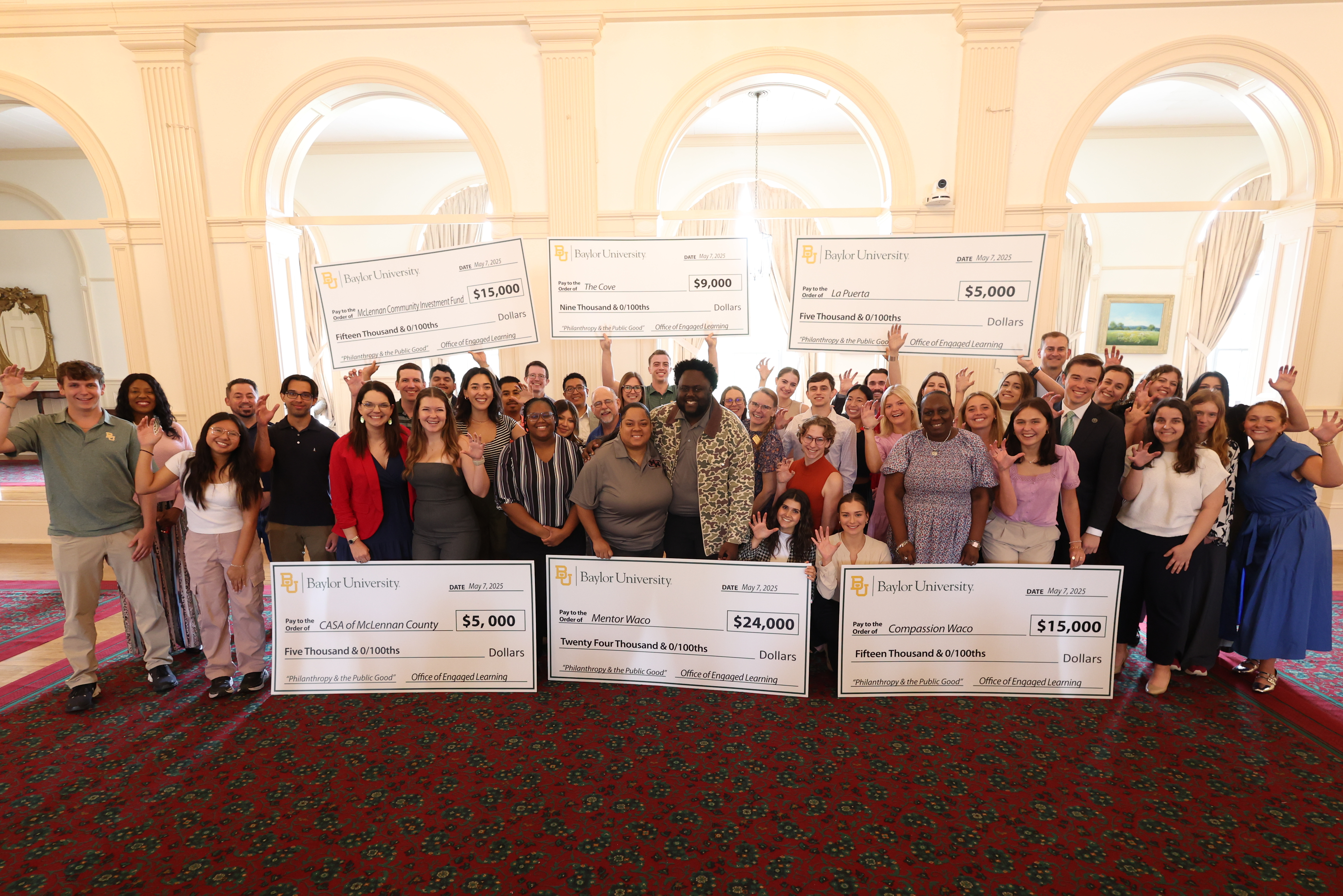 Students presenting checks
